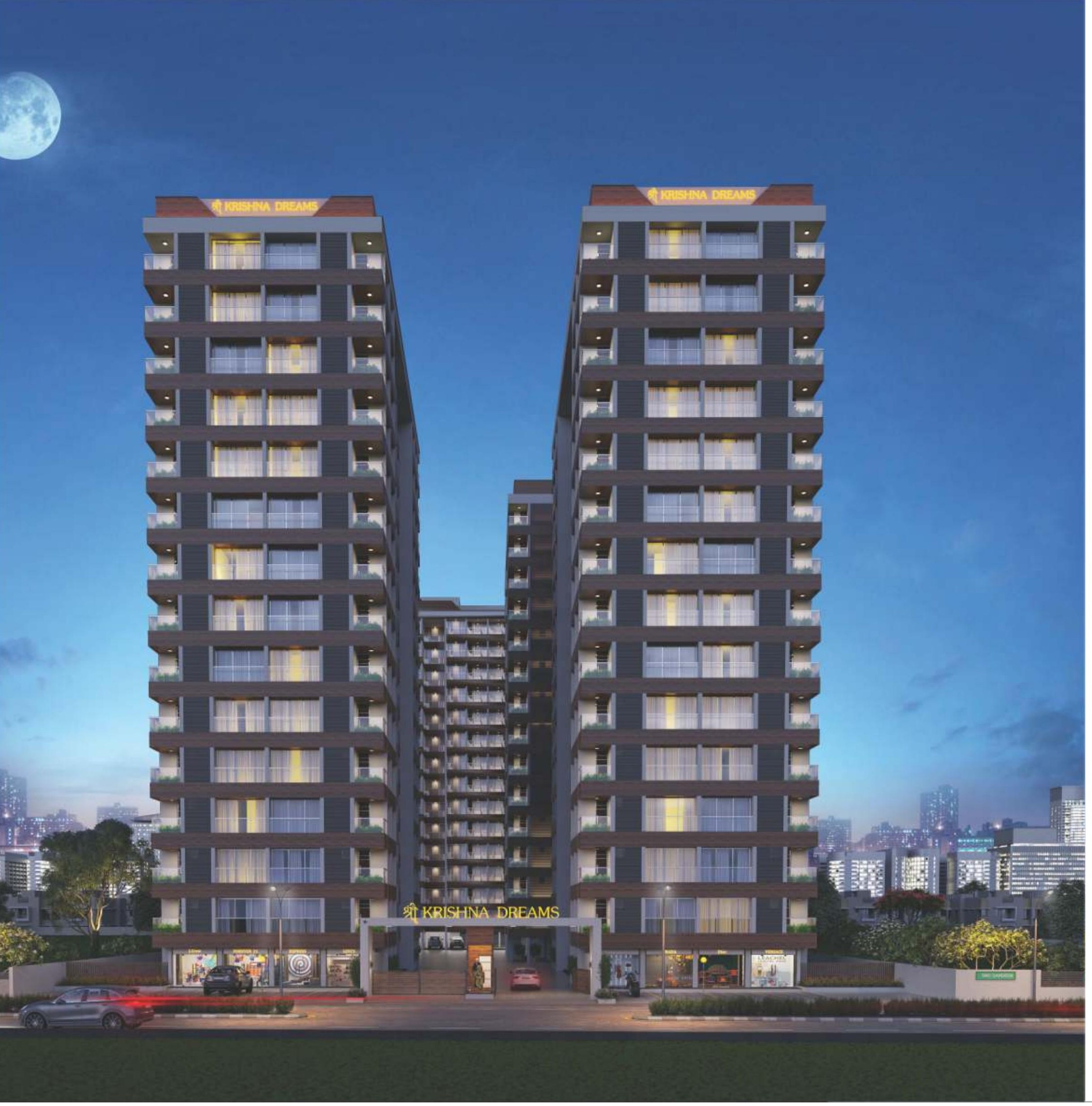 Shree Krishna Dreams twin towers illuminated at night, Godadara, Surat